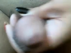 Ebony shemale wanking cock in closeup