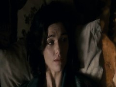 Rachel Weisz lying naked facing a guy in bed, seen from